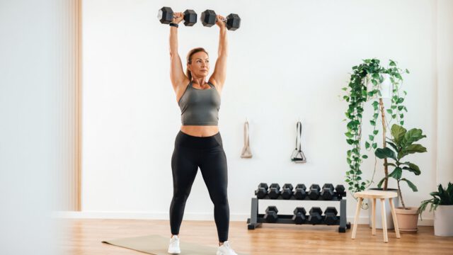 Woman working out with dumbells